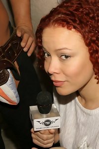 two black women in stockings on the couch