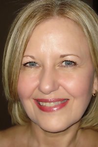 the blonde milf spreads her hairy legs